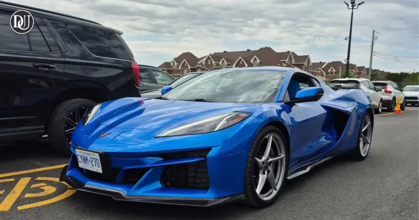 2025 Corvette E-Ray hybrid V8 sports car in motion with aggressive new design