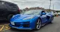 2025 Corvette E-Ray hybrid V8 sports car in motion with aggressive new design